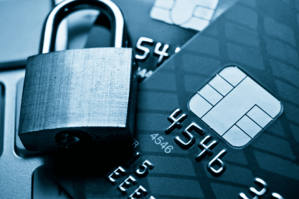 Lock and credit card showing merchant fraud.